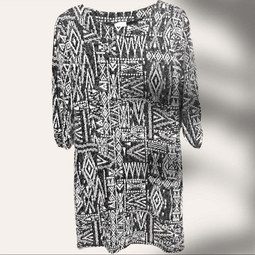 Timeless sweater dress with a unique pattern. Dress it up or down! Like new!
